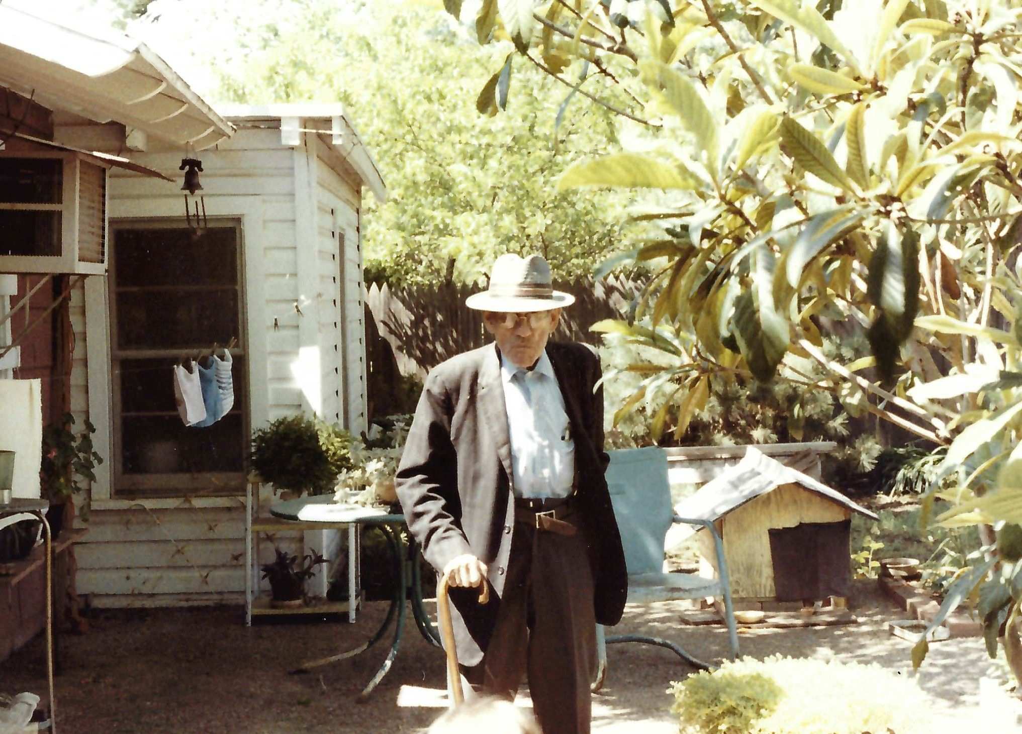 RL Meador walking out back door towards nursery 80s