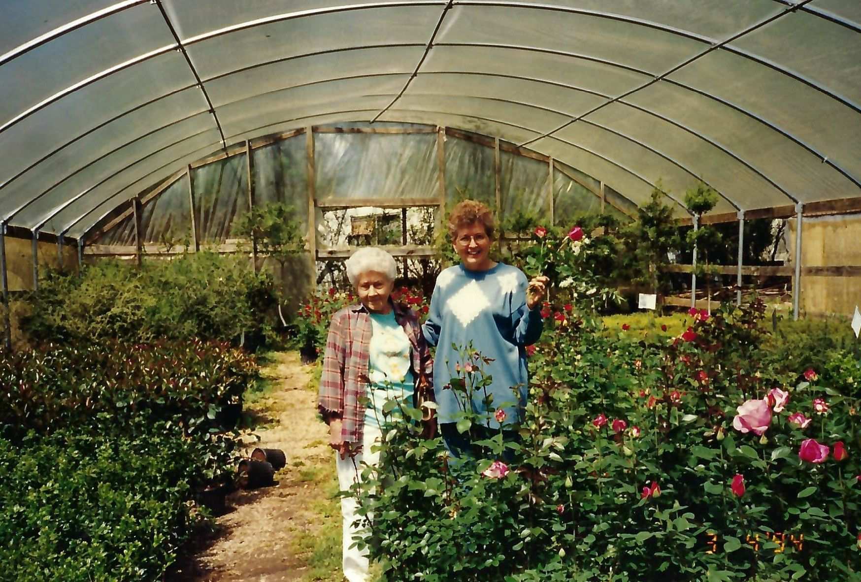 Gene and her mother in the nursery greenhouse 80s