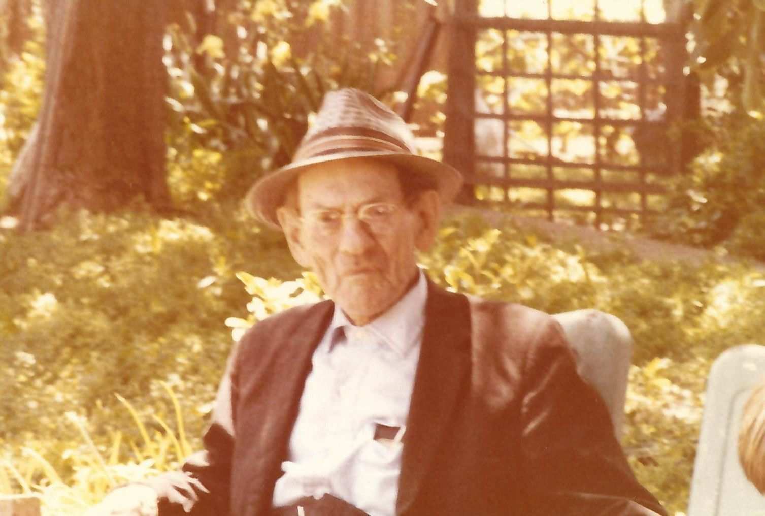 RL Meador seated in the garden at his home behind the nursery 80s